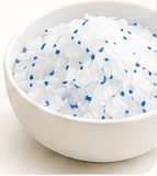Crystal cat litter in a white bowl