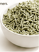 Green tofu cat litter pellets in a white bowl
