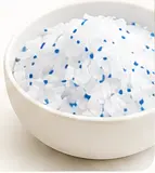 Crystal cat litter in a white bowl