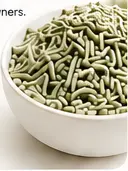 Green tofu cat litter pellets in a white bowl